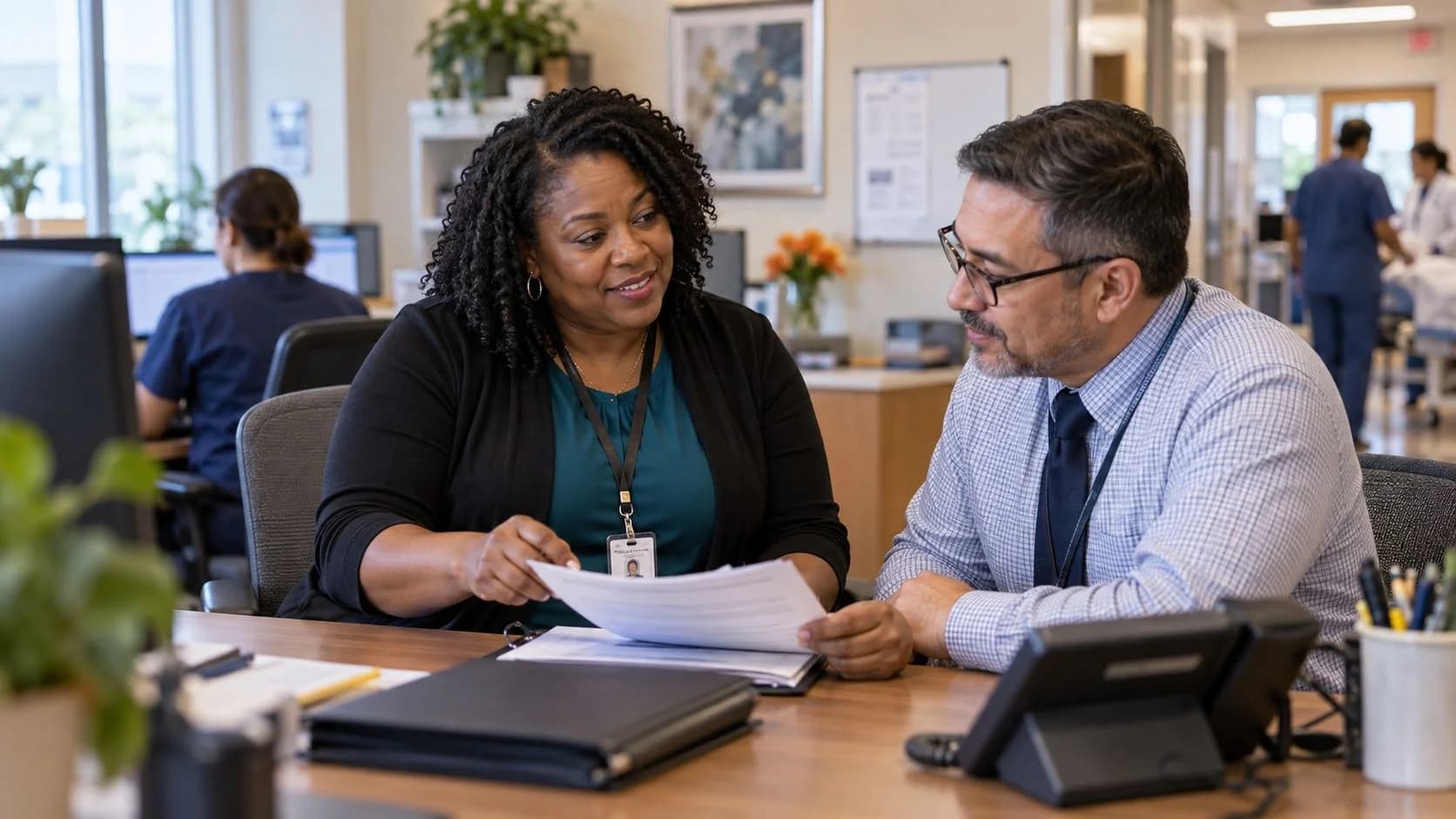Reimbursement analyst and revenue manager reviewing a payment variance