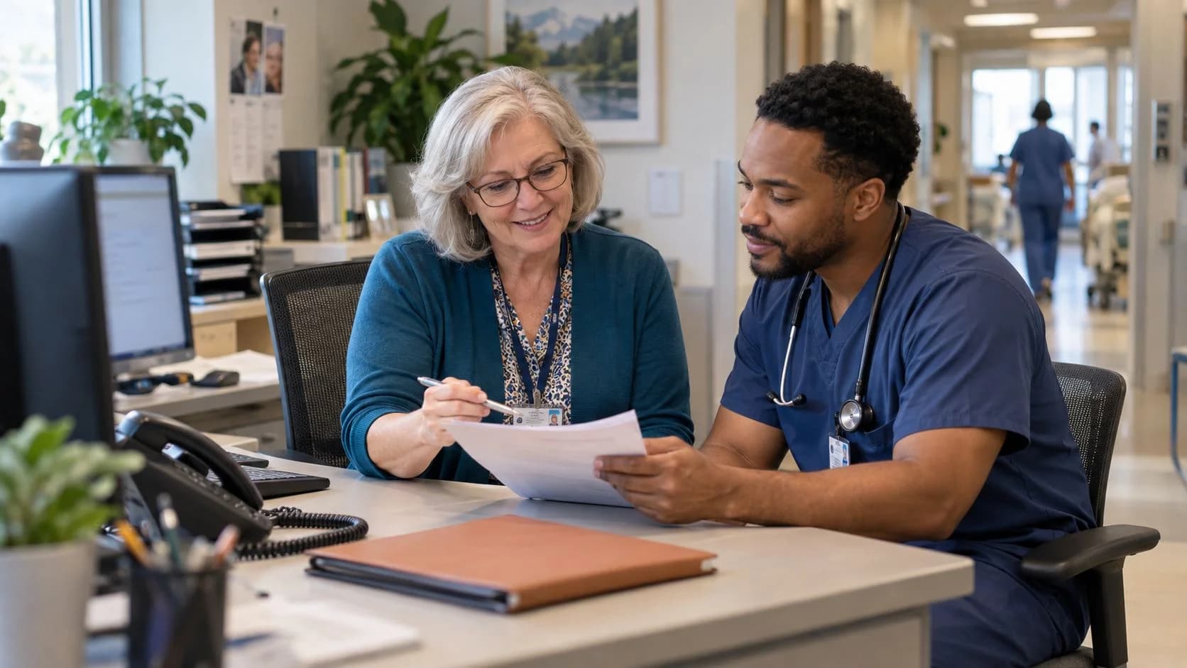 Medical coder and clinician resolving a claim detail together