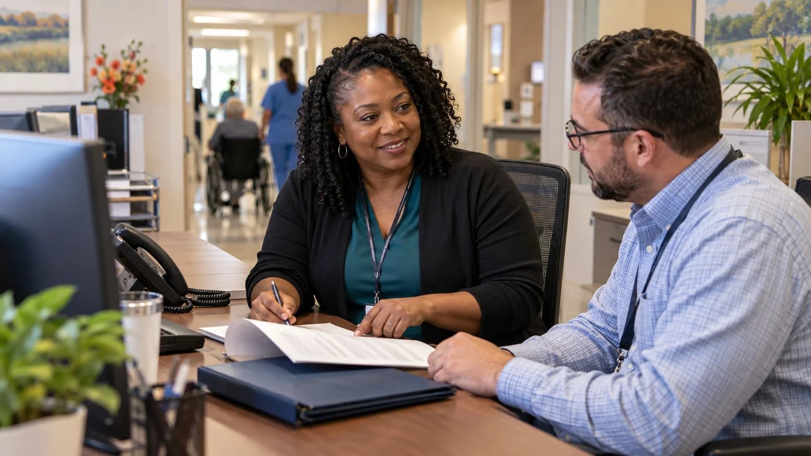 Reimbursement analyst and revenue manager reviewing a payment variance