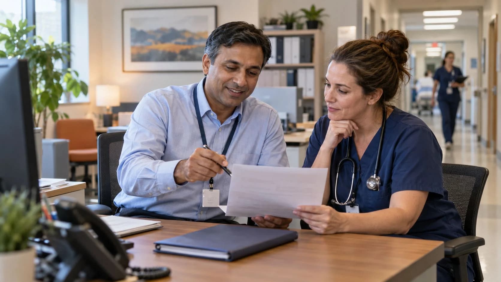 Medical coder and clinician resolving a claim detail together