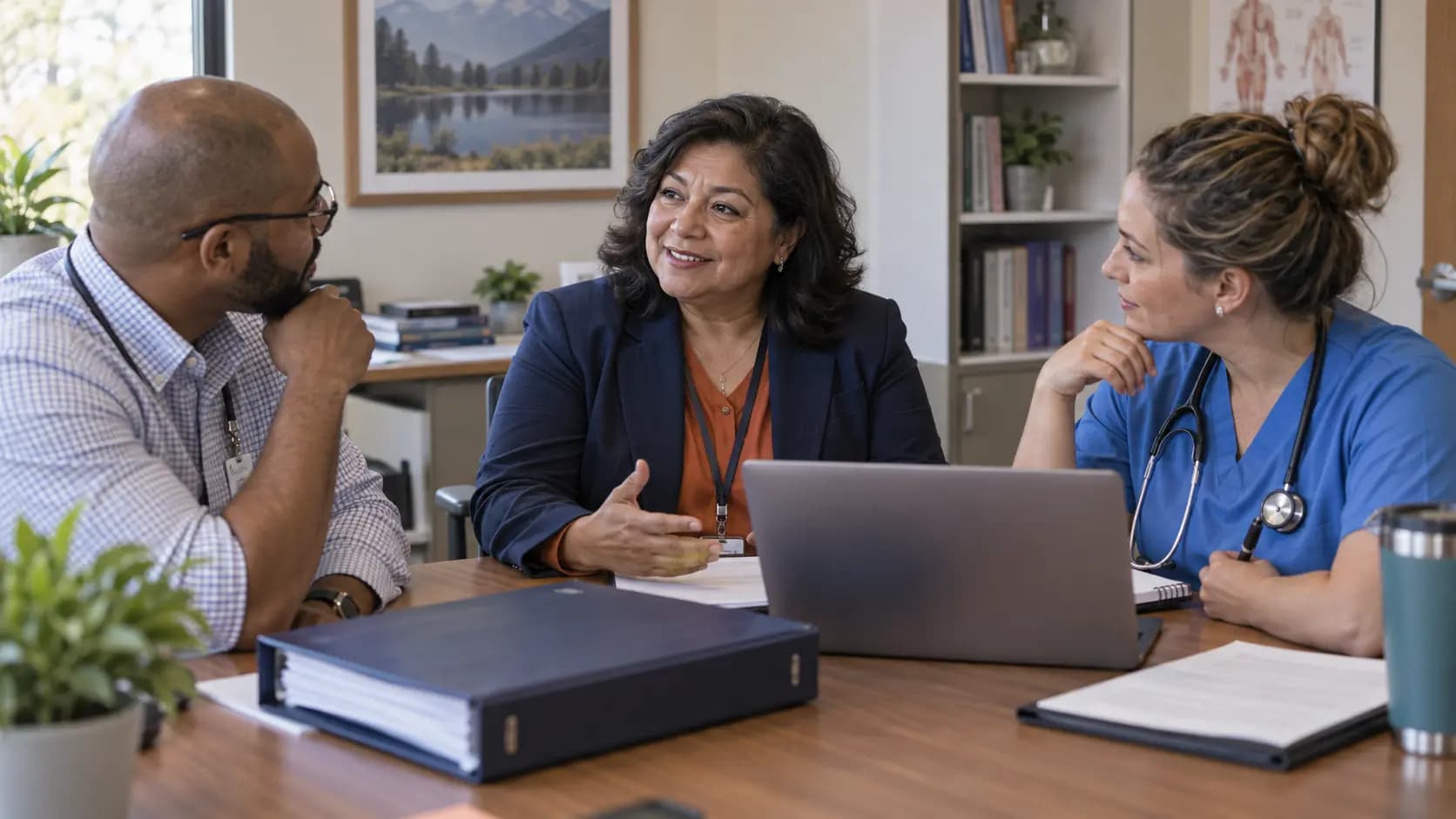 Healthcare compliance officer meeting with a clinician and practice manager Healthcare compliance officer meeting with a clinician and practice manager