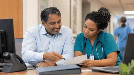 Medical coder and clinician resolving a claim detail together