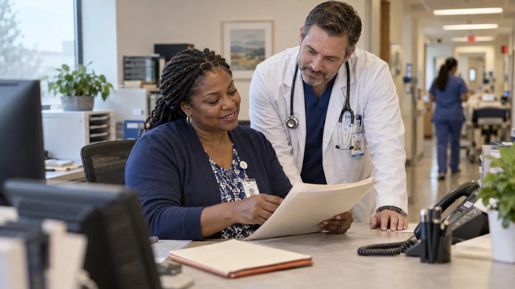 Medical coder and clinician resolving a claim detail together