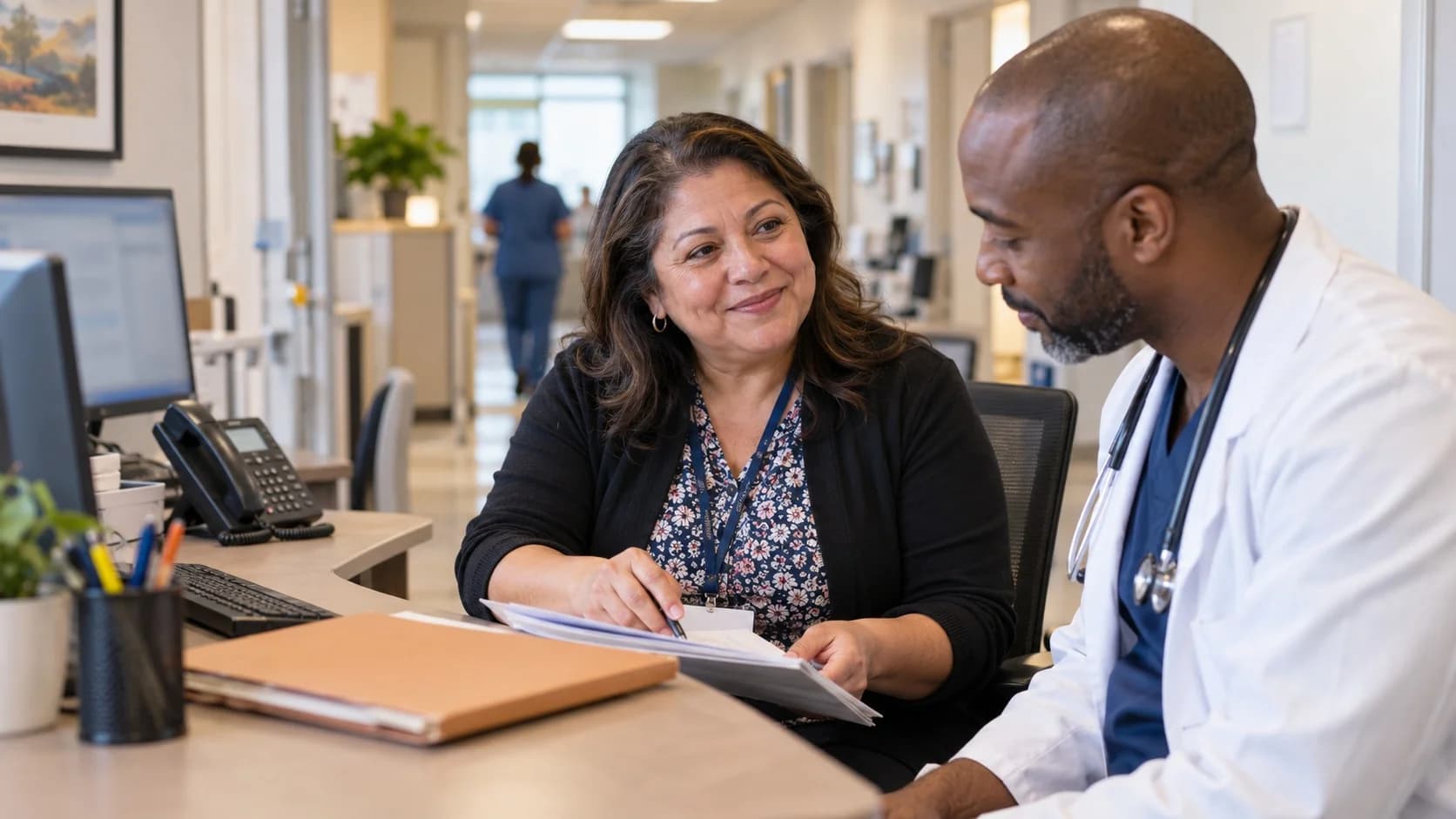 Medical coder and clinician resolving a claim detail together