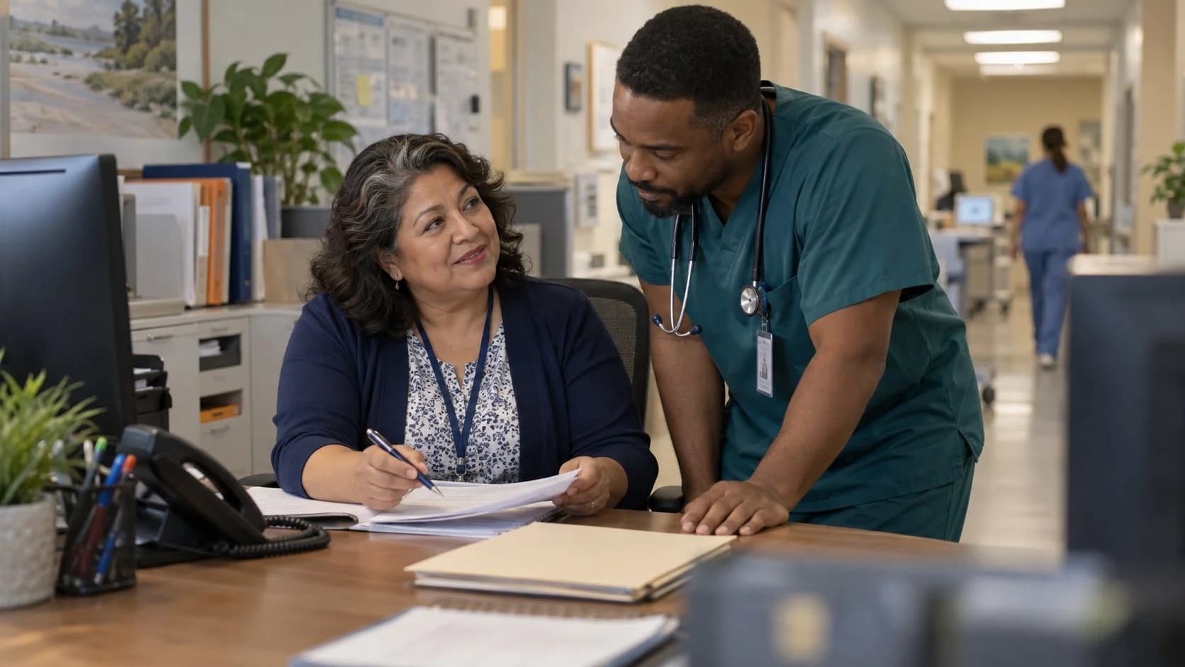 Medical coder and clinician resolving a claim detail together