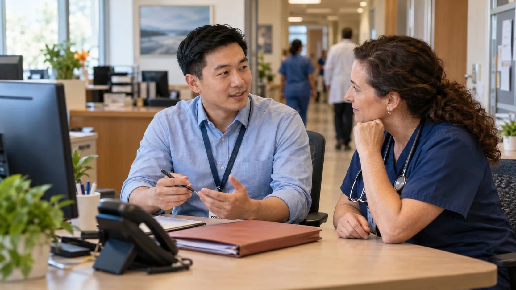 Medical coder and clinician resolving a claim detail together