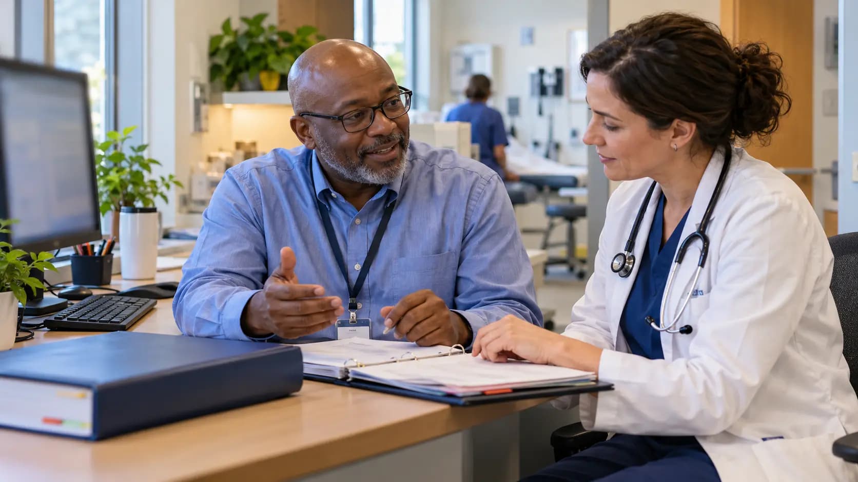 Medical coder and clinician resolving documentation together Medical coder and clinician resolving documentation together