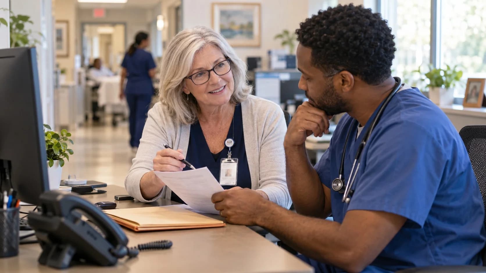 Medical coder and clinician resolving a claim detail together