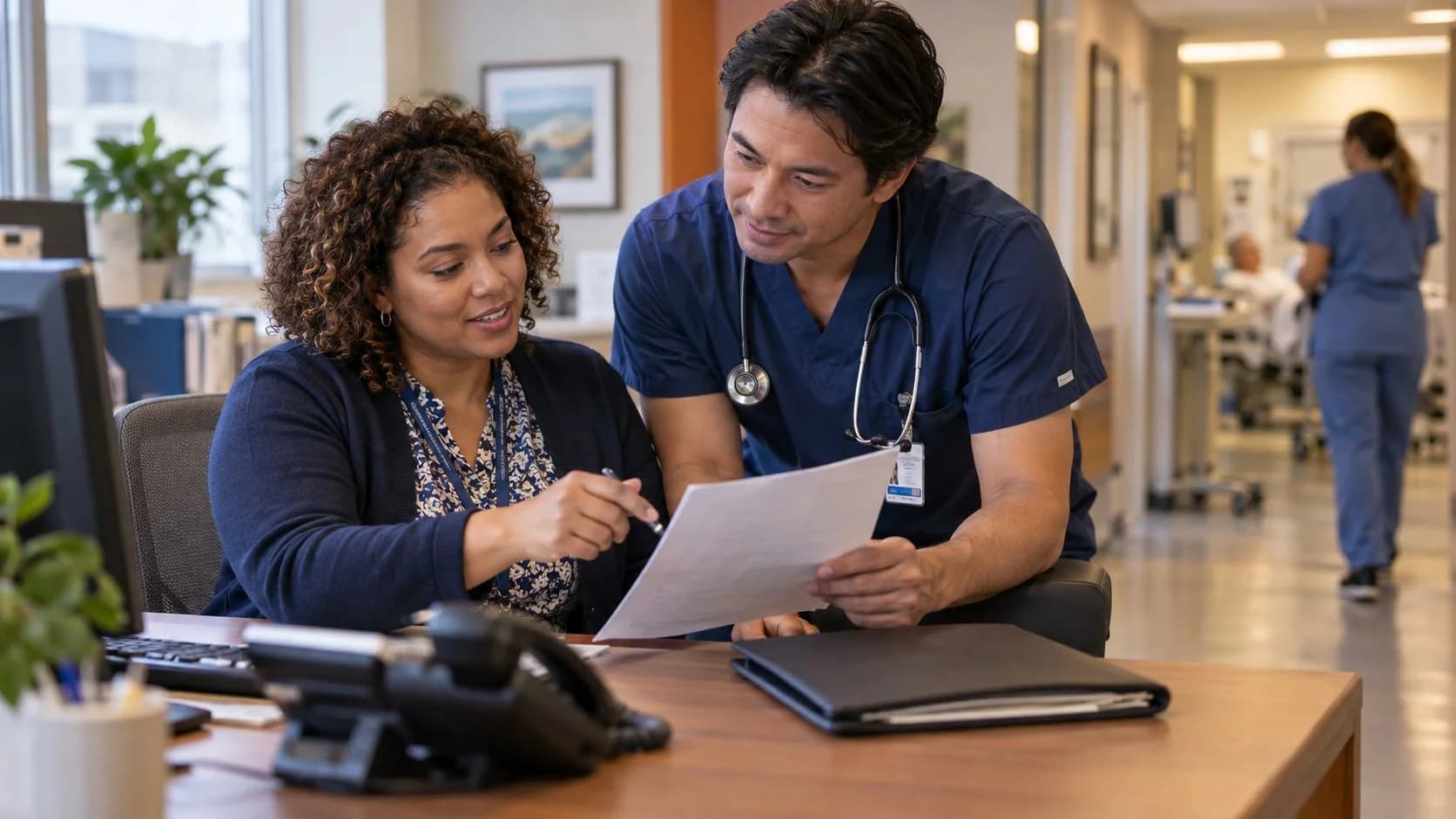 Medical coder and clinician resolving a claim detail together
