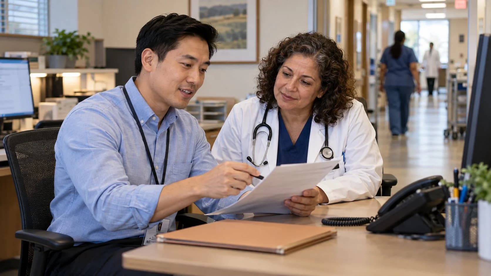 Medical coder and clinician resolving a claim detail together
