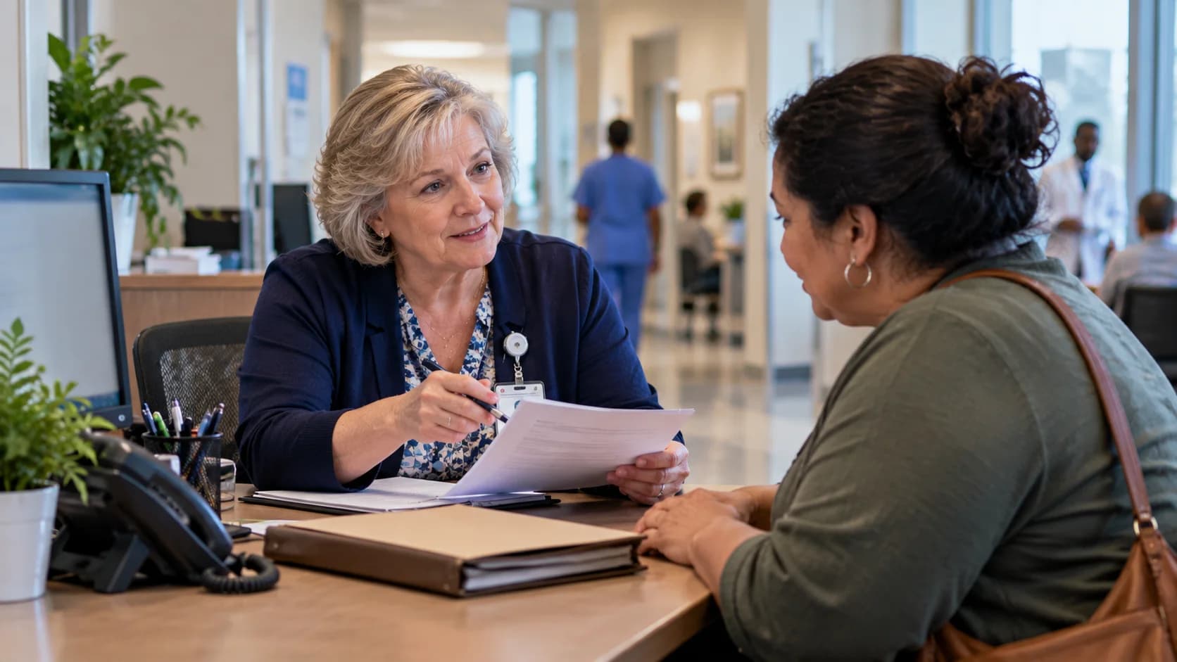 Patient financial counselor explaining a billing responsibility to a patient
