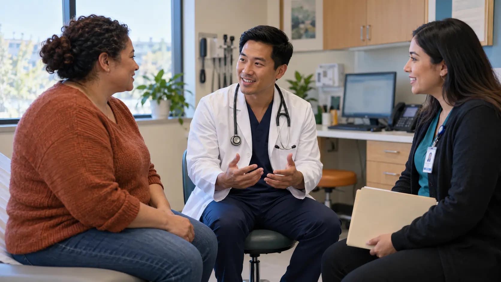 Clinician, patient, and healthcare colleague sharing a warm clinic interaction
