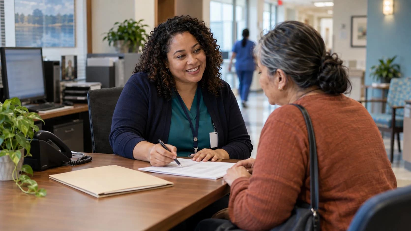 Patient financial counselor explaining a billing responsibility to a patient