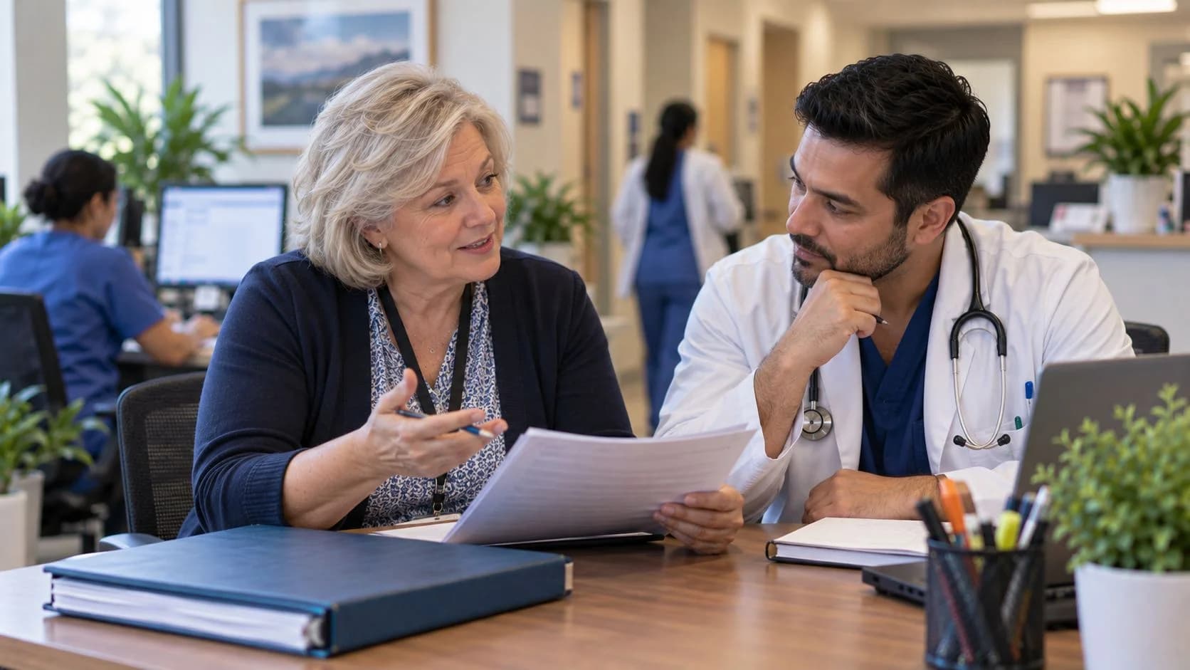 Denial specialist and clinician reviewing a claim workflow together