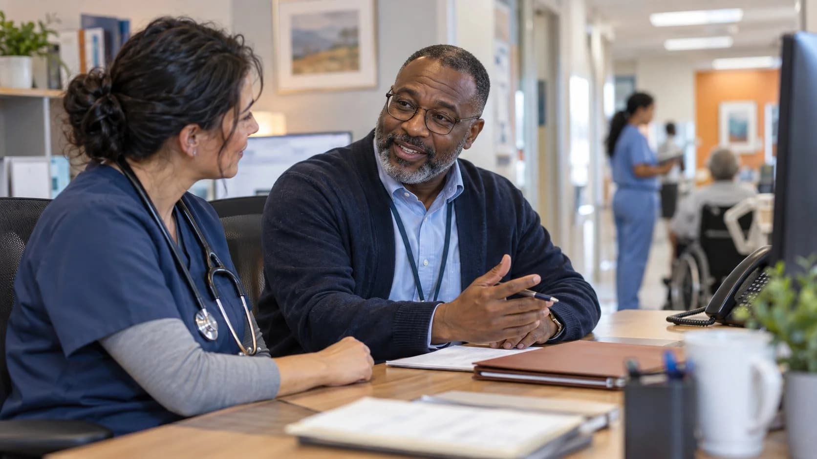 Medical coder and clinician resolving a claim detail together