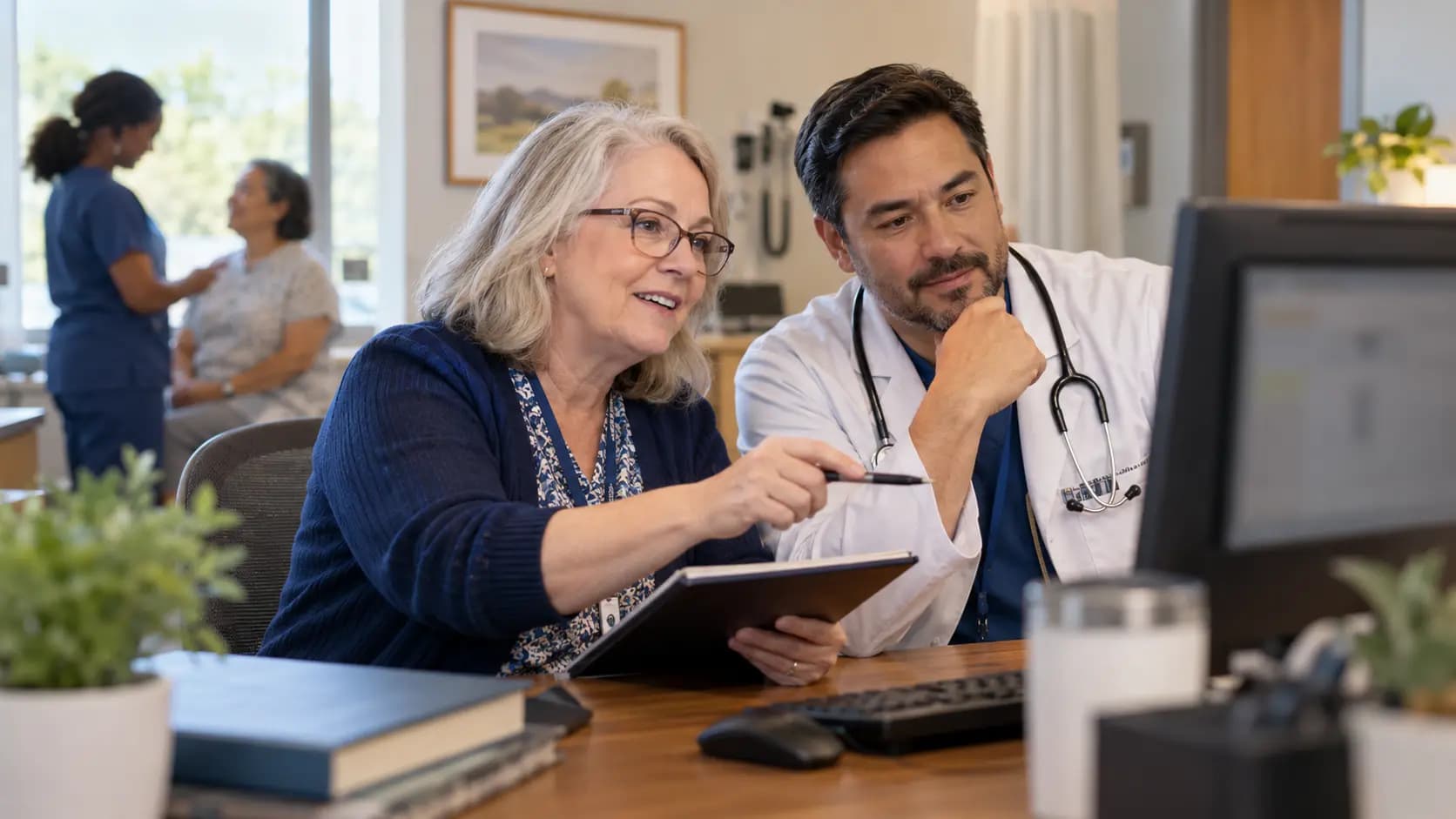 Medical coder and clinician resolving documentation together