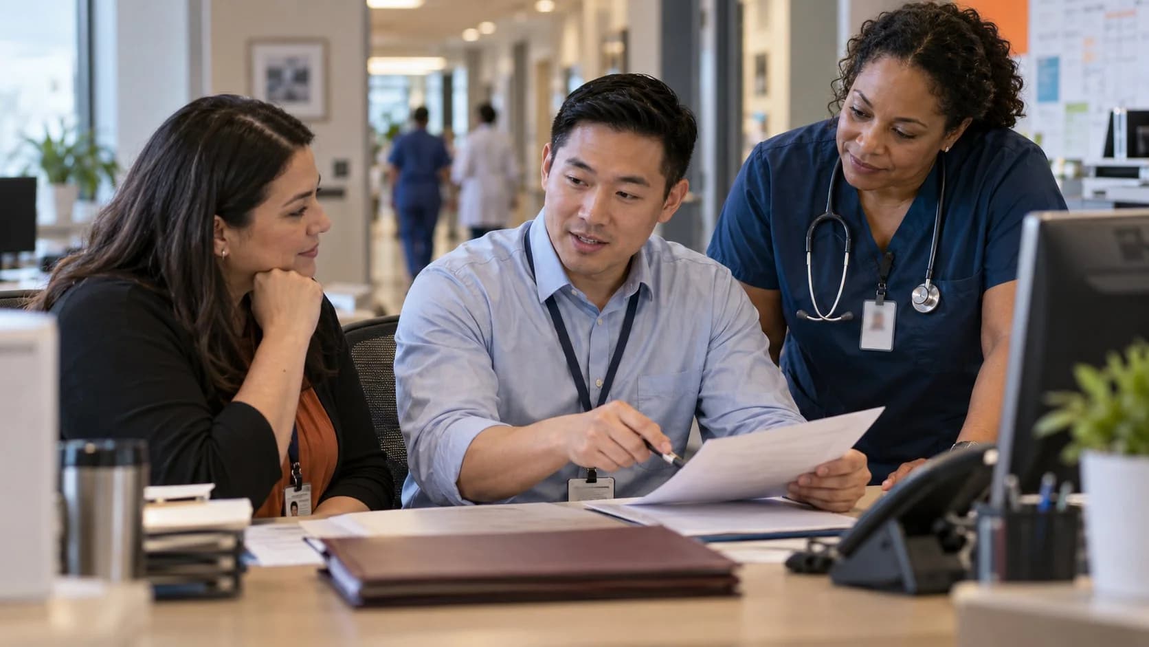 Denial-resolution specialist and clinician reviewing a claim together