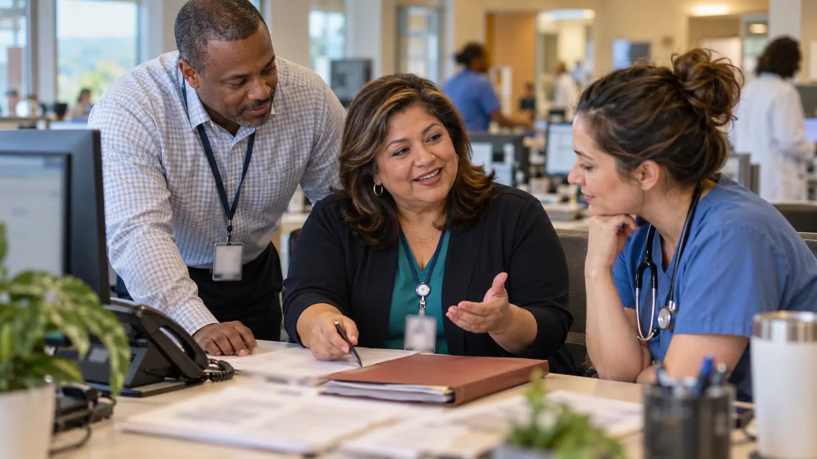 Revenue-cycle specialist and clinician resolving a billing workflow together Revenue-cycle specialist and clinician resolving a billing workflow together