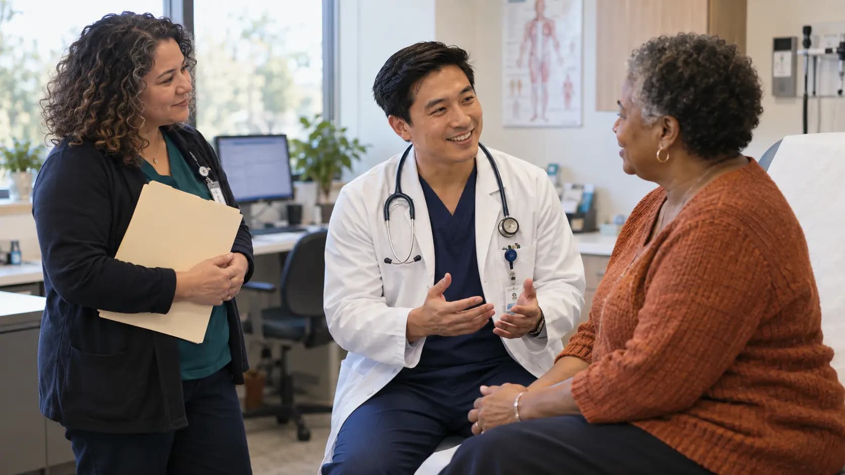 Clinician, patient, and healthcare colleague sharing a warm clinic interaction