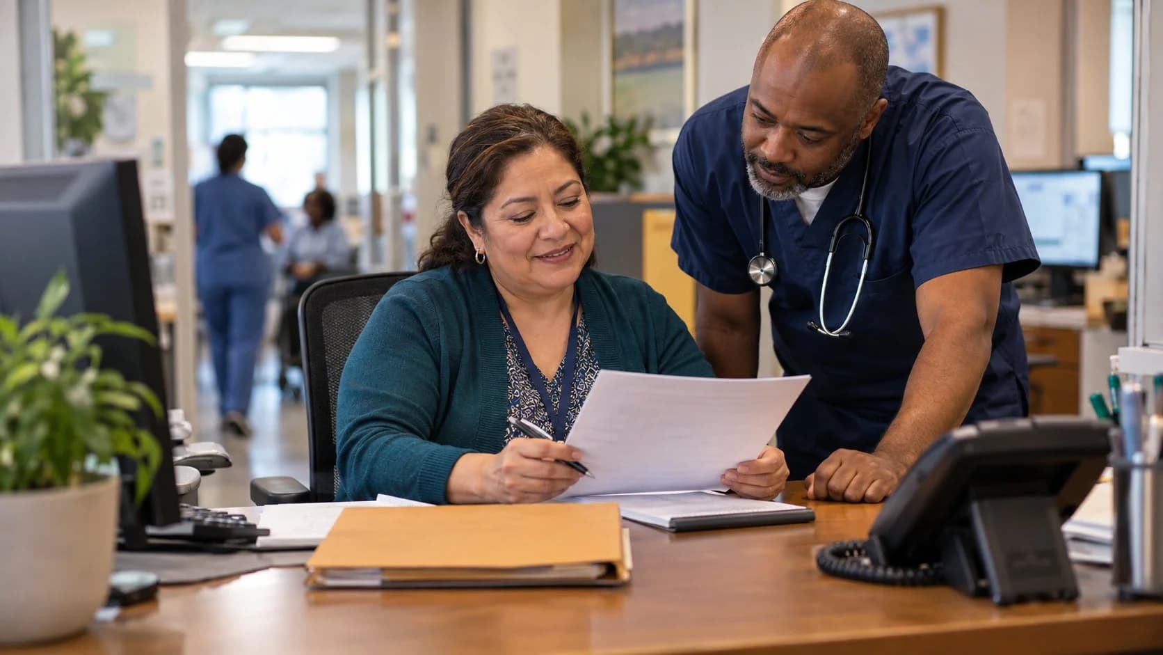 Medical coder and clinician resolving a claim detail together