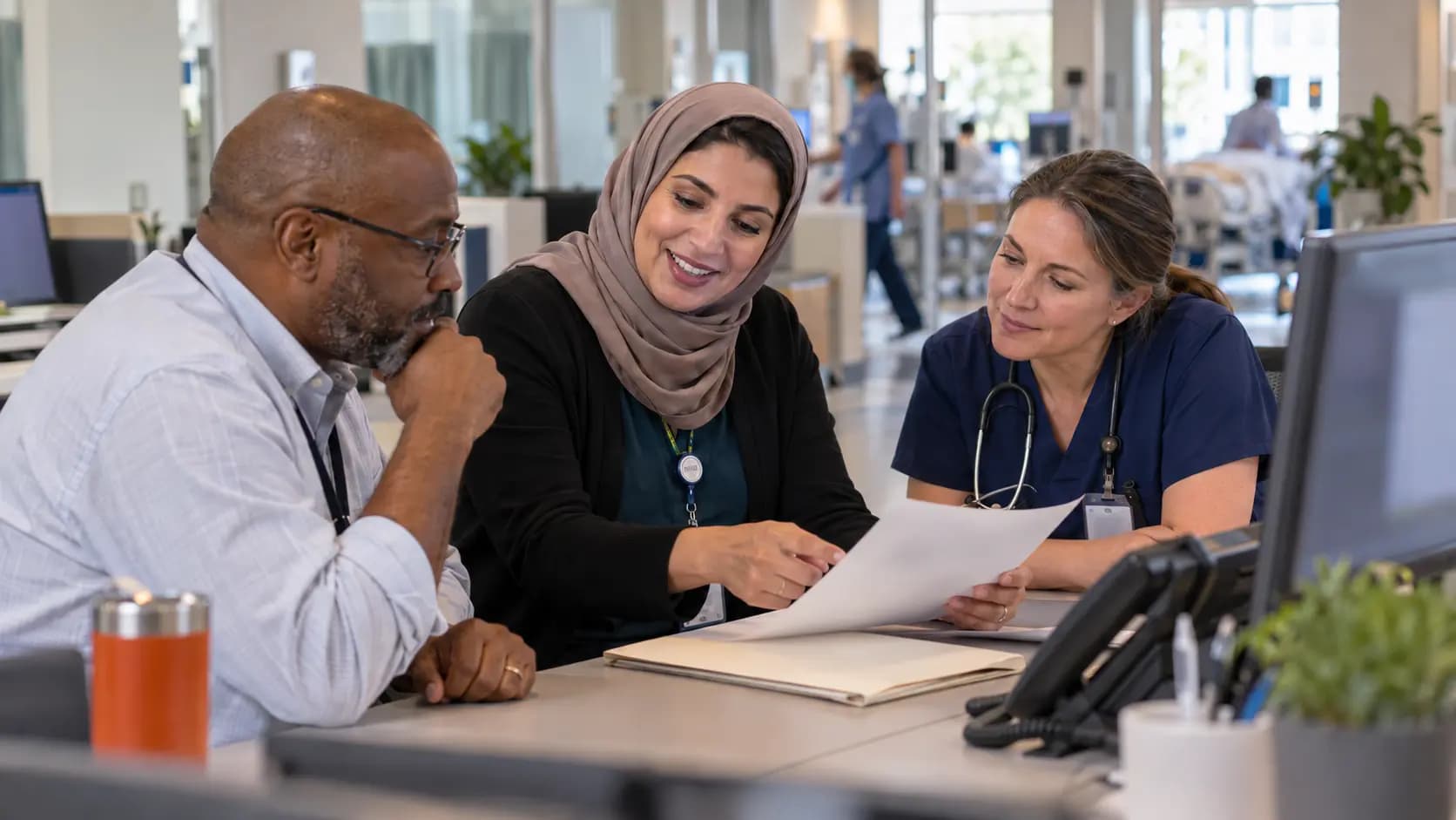 Revenue-cycle specialist and clinician resolving a billing workflow together