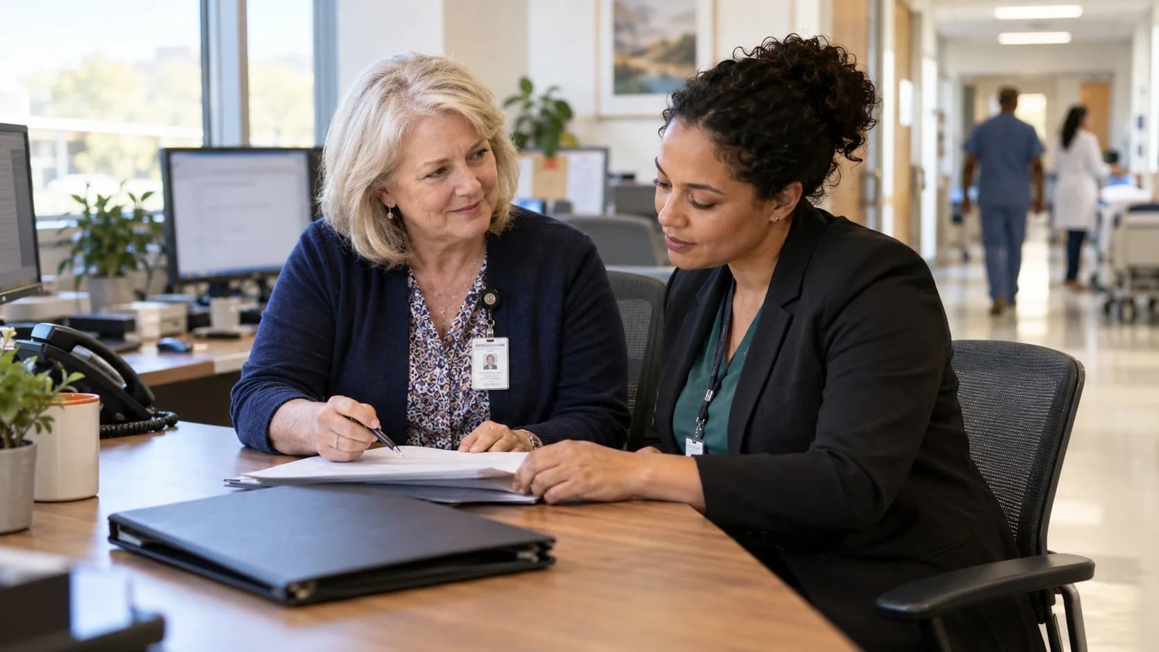 Reimbursement analyst and revenue manager reviewing a payment variance