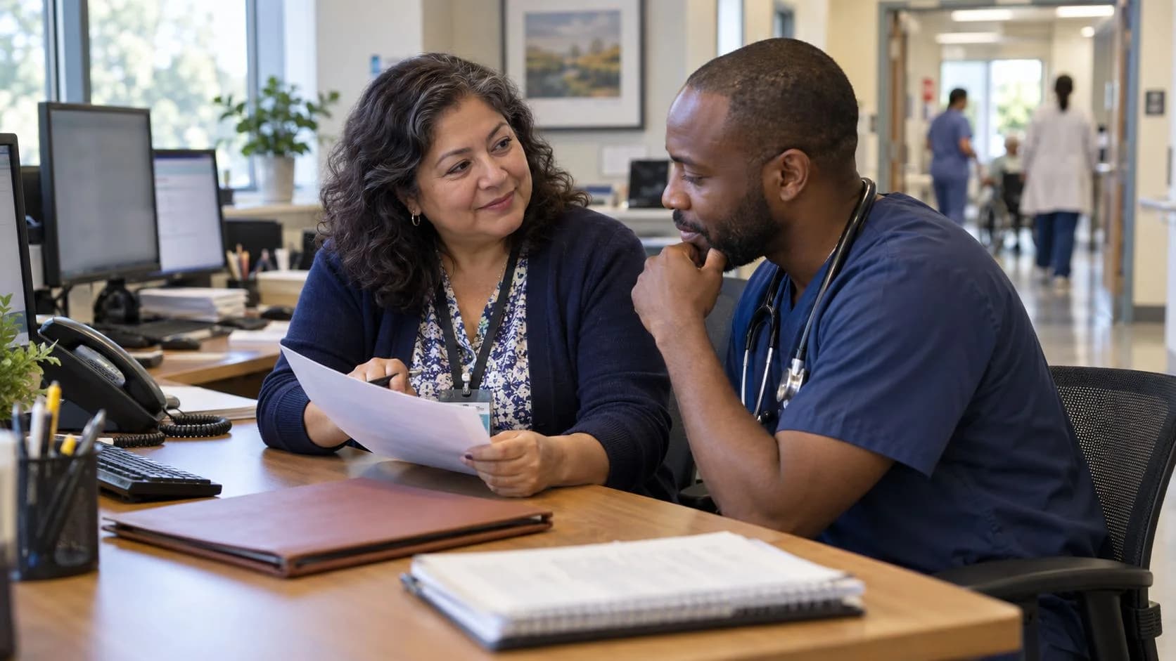 Medical coder and clinician resolving a claim detail together