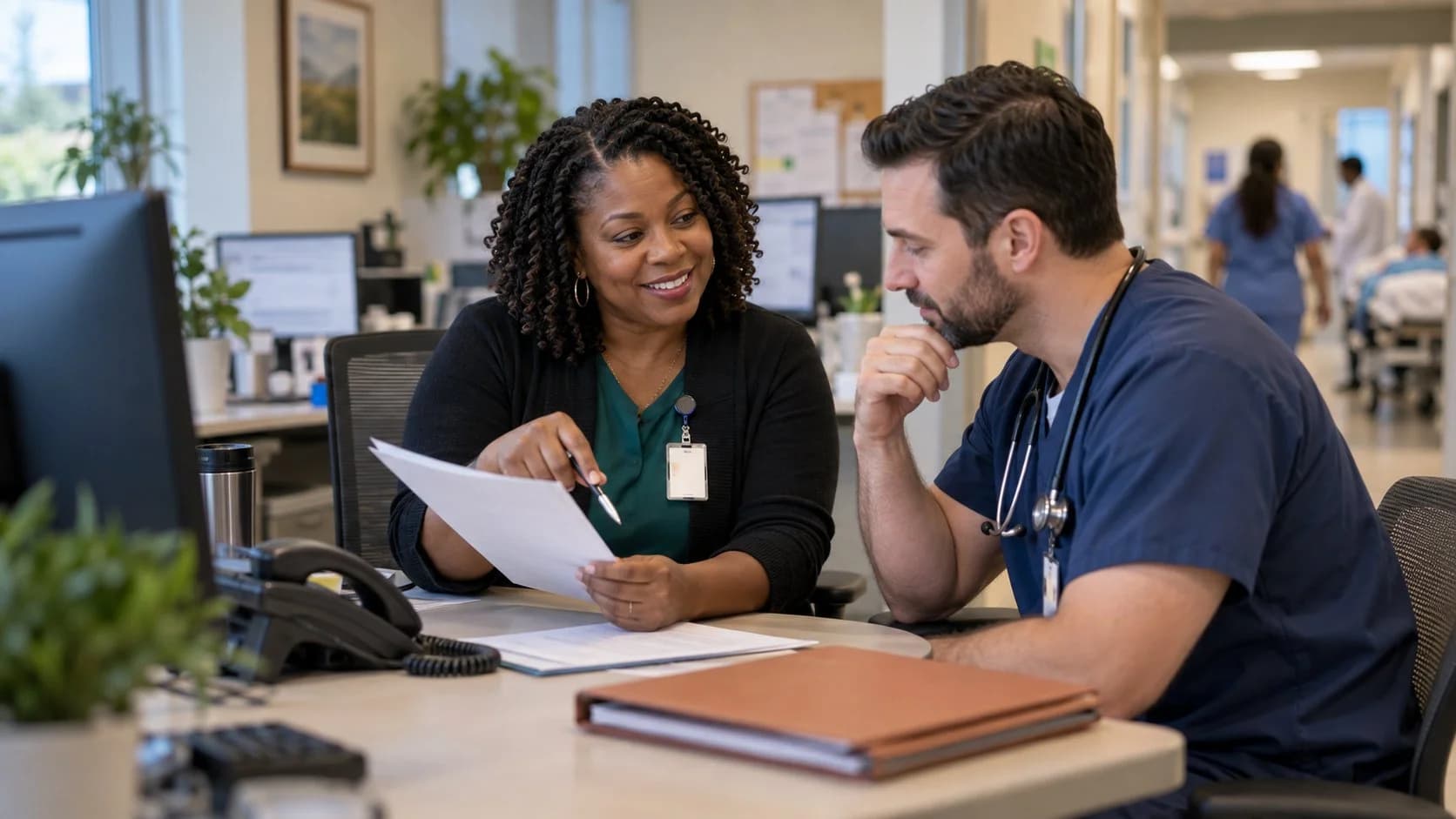 Medical coder and clinician resolving a claim detail together