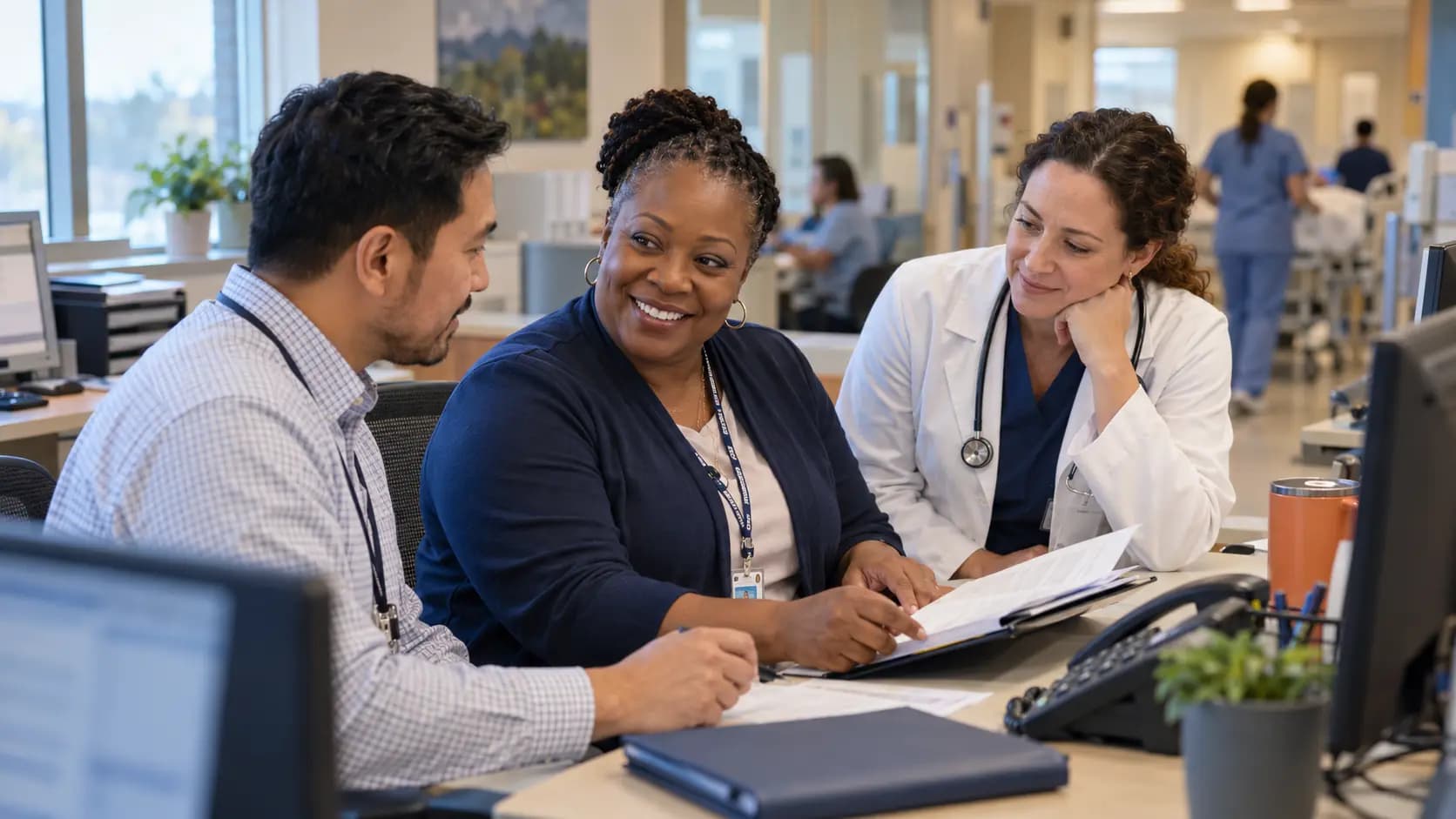 Revenue-cycle specialist and clinician resolving a billing workflow together Revenue-cycle specialist and clinician resolving a billing workflow together