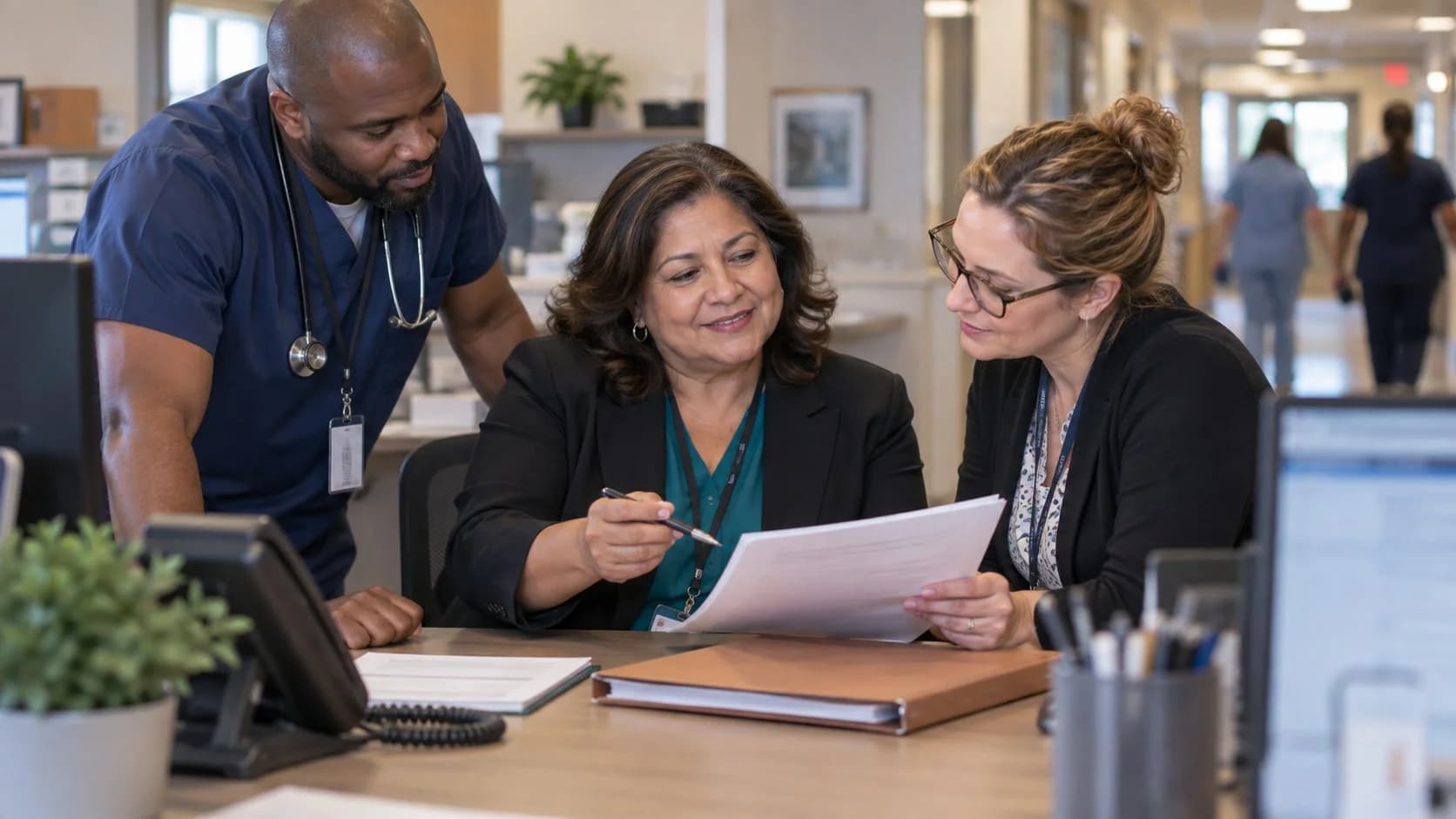 Denial-resolution specialist and clinician reviewing a claim together