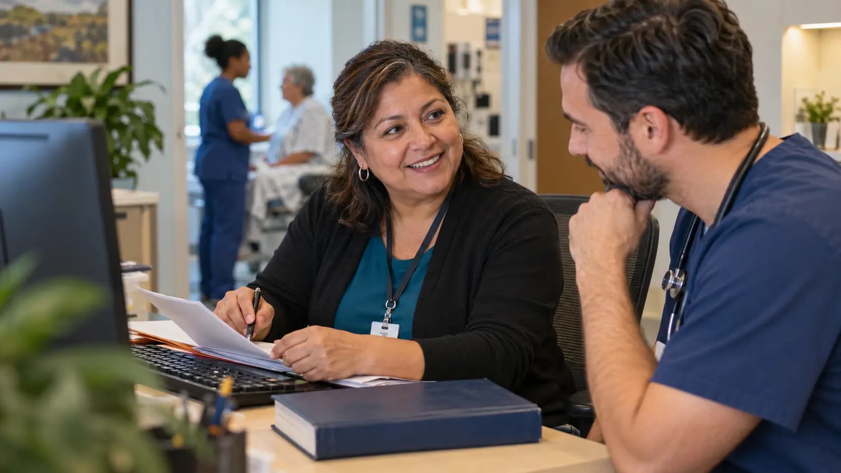 Medical coder and clinician resolving documentation together
