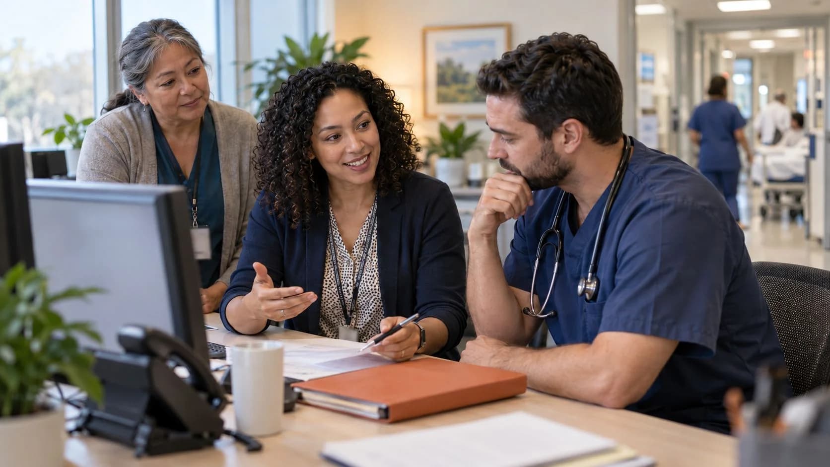 Medical coder and clinician resolving a claim detail together