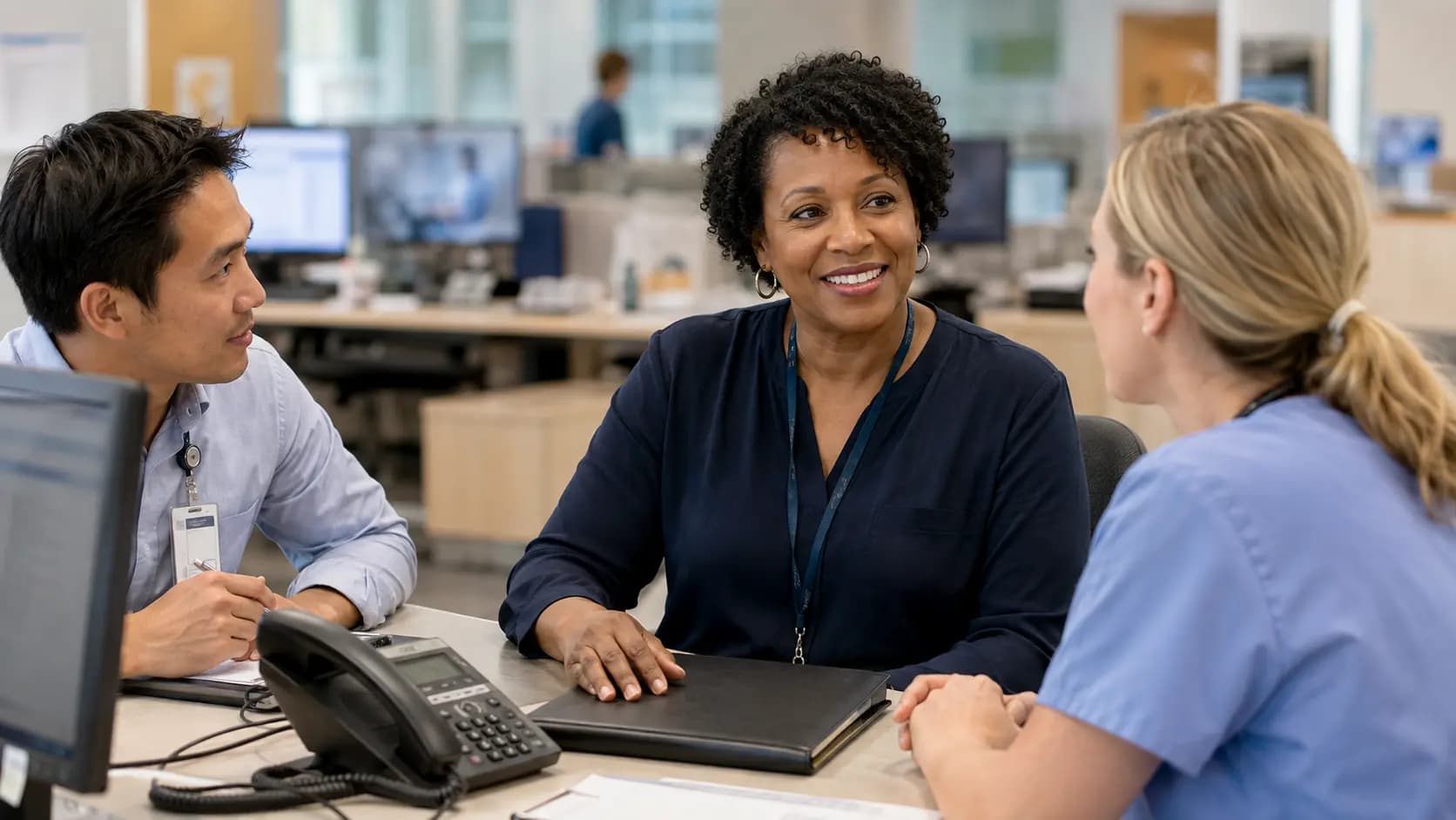 Revenue-cycle specialist and clinician resolving a billing workflow together