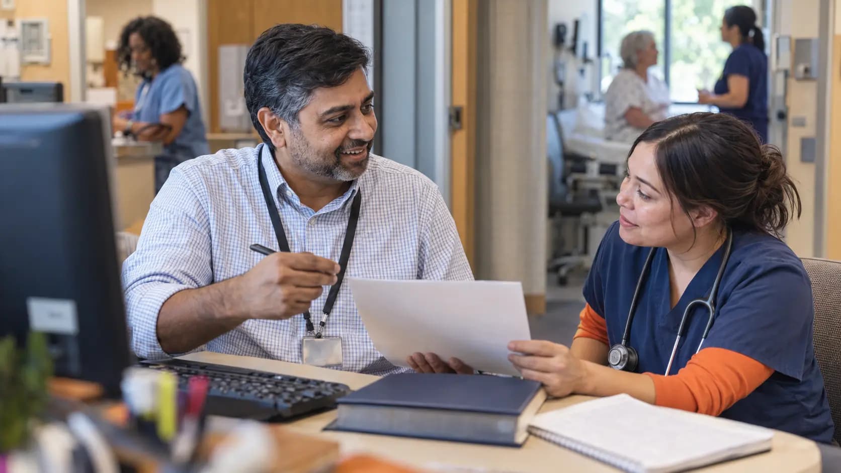 Medical coder and clinician resolving documentation together