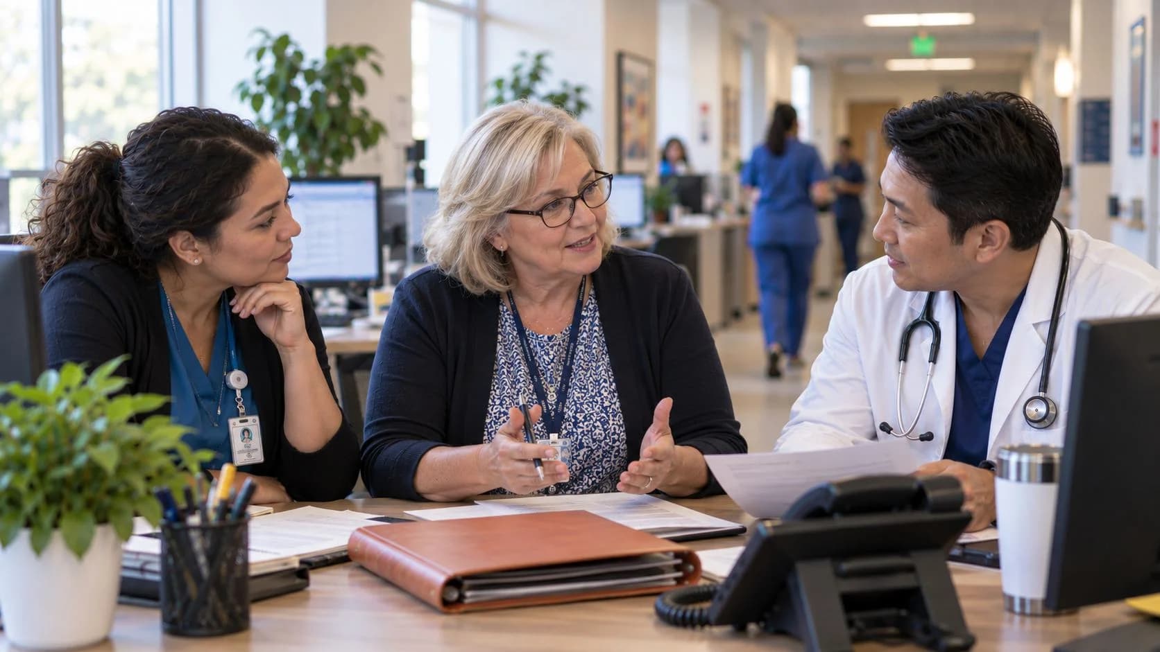 Denial-resolution specialist and clinician reviewing a claim together
