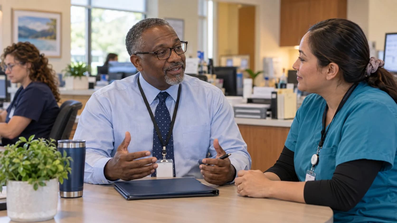Healthcare compliance officer reviewing a safe workflow with clinic staff