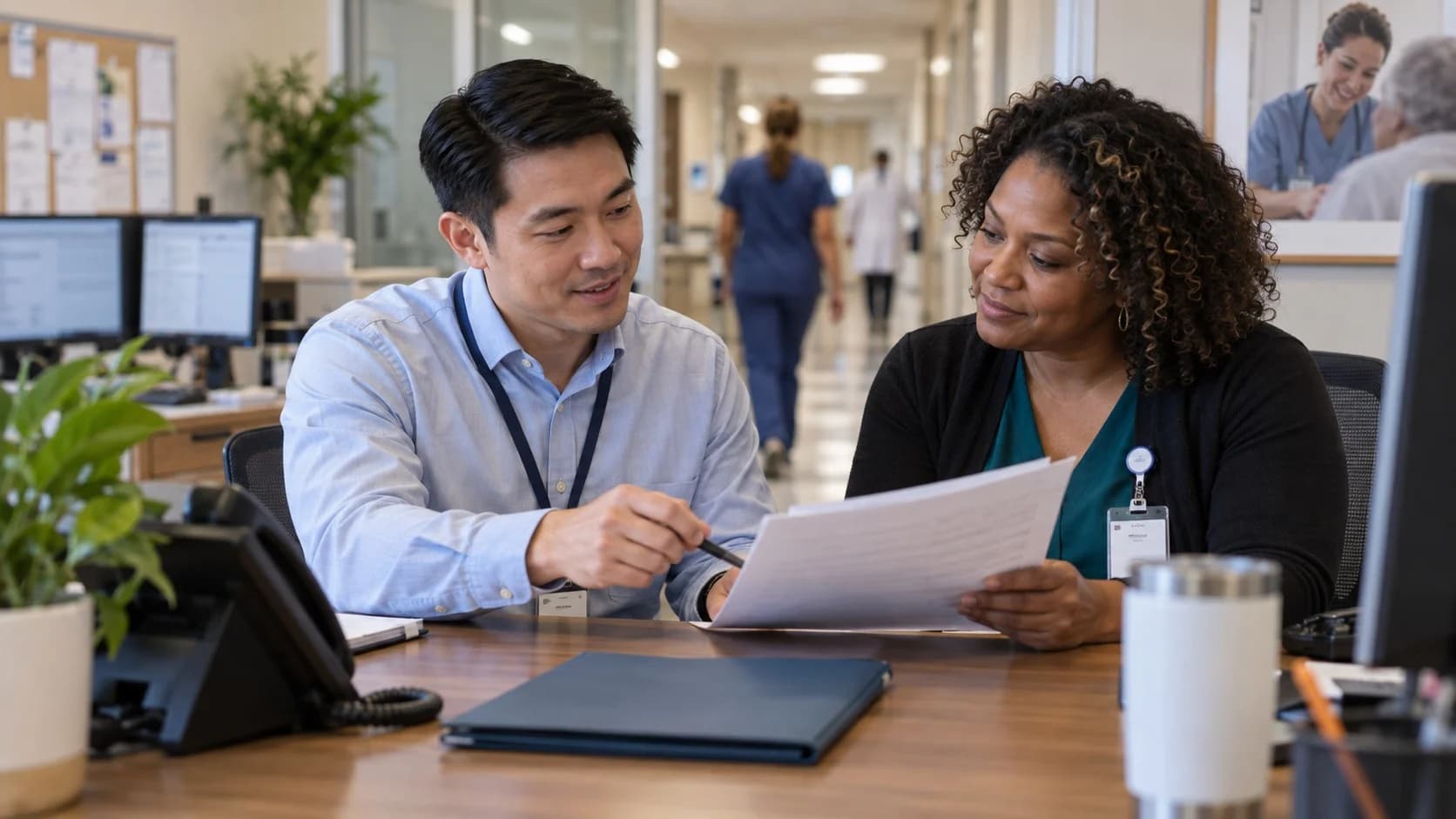 Reimbursement analyst and revenue manager reviewing a payment variance