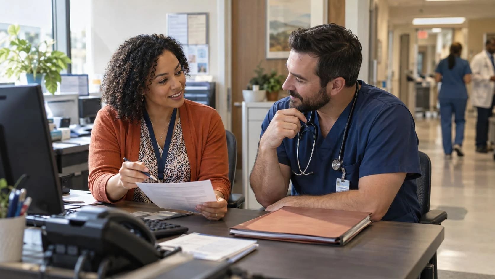 Medical coder and clinician resolving a claim detail together