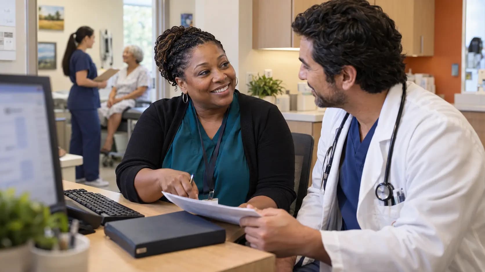 Medical coder and clinician resolving documentation together
