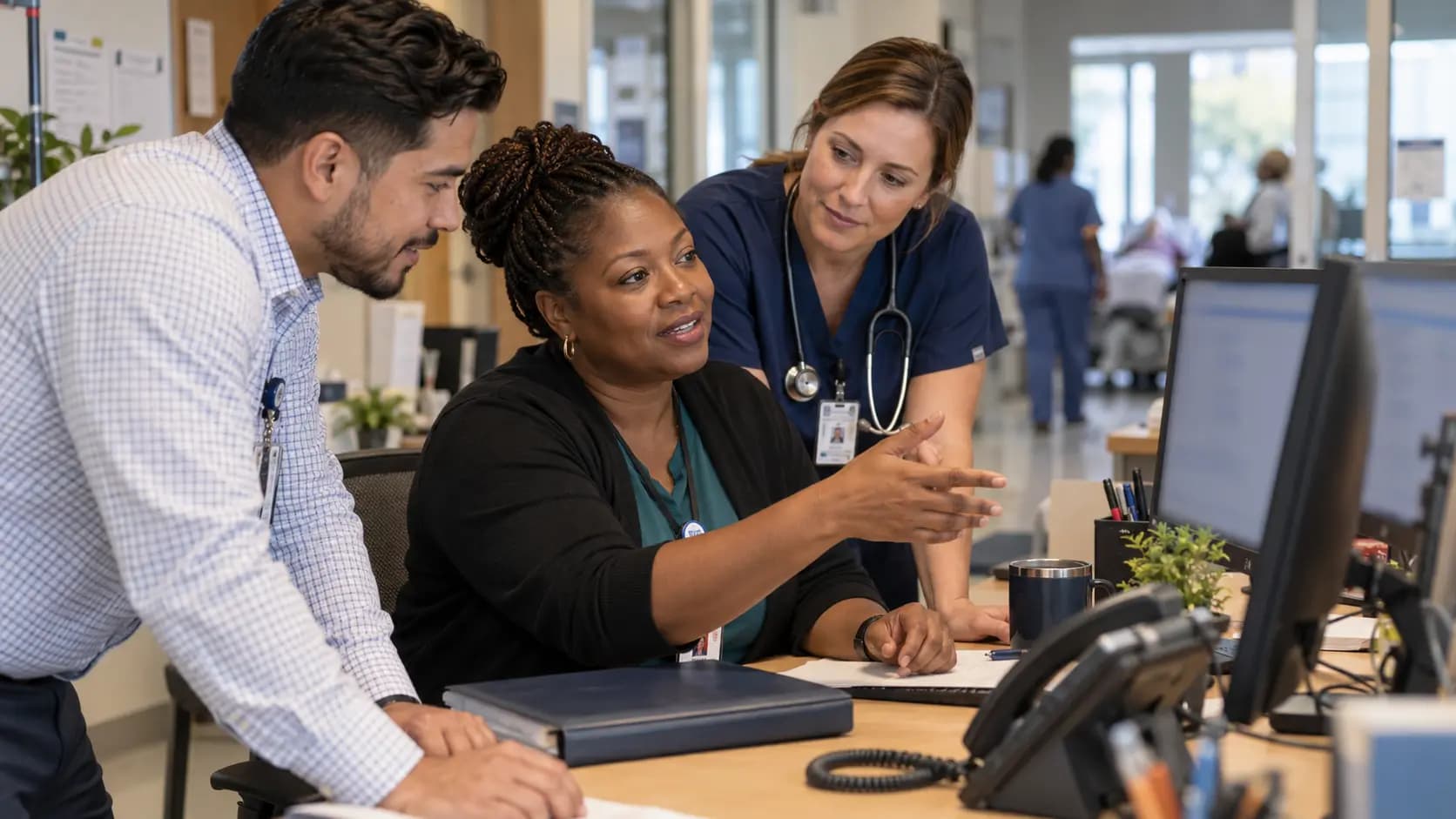 Revenue-cycle specialist and clinician resolving a billing workflow together Revenue-cycle specialist and clinician resolving a billing workflow together