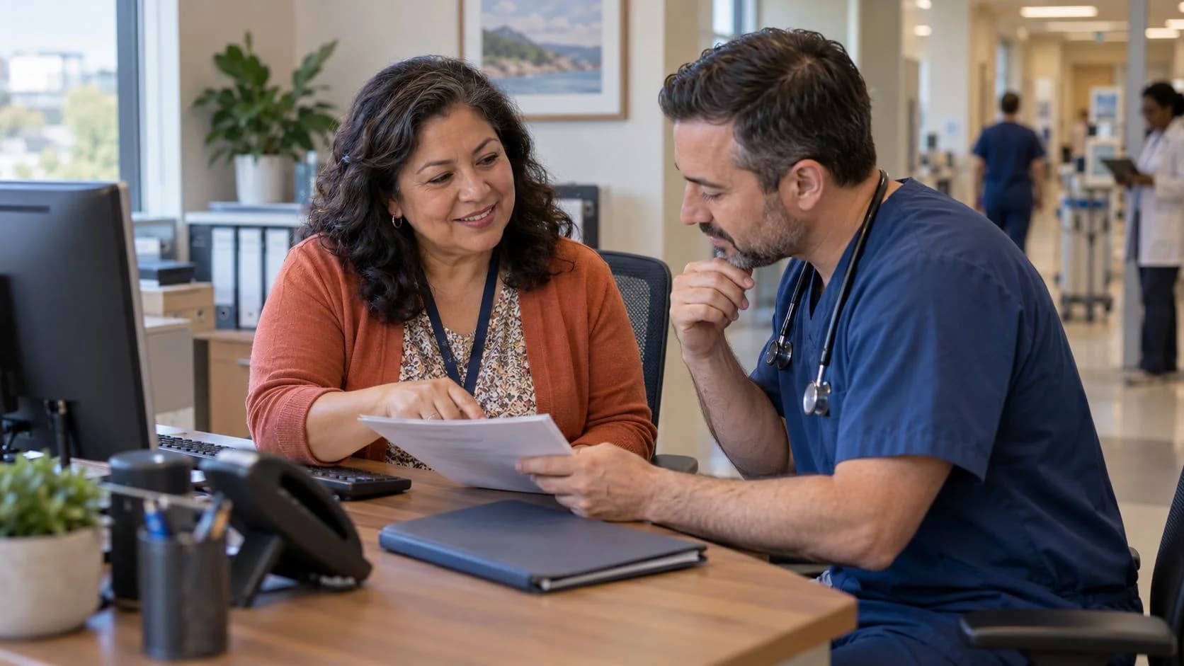 Medical coder and clinician resolving a claim detail together