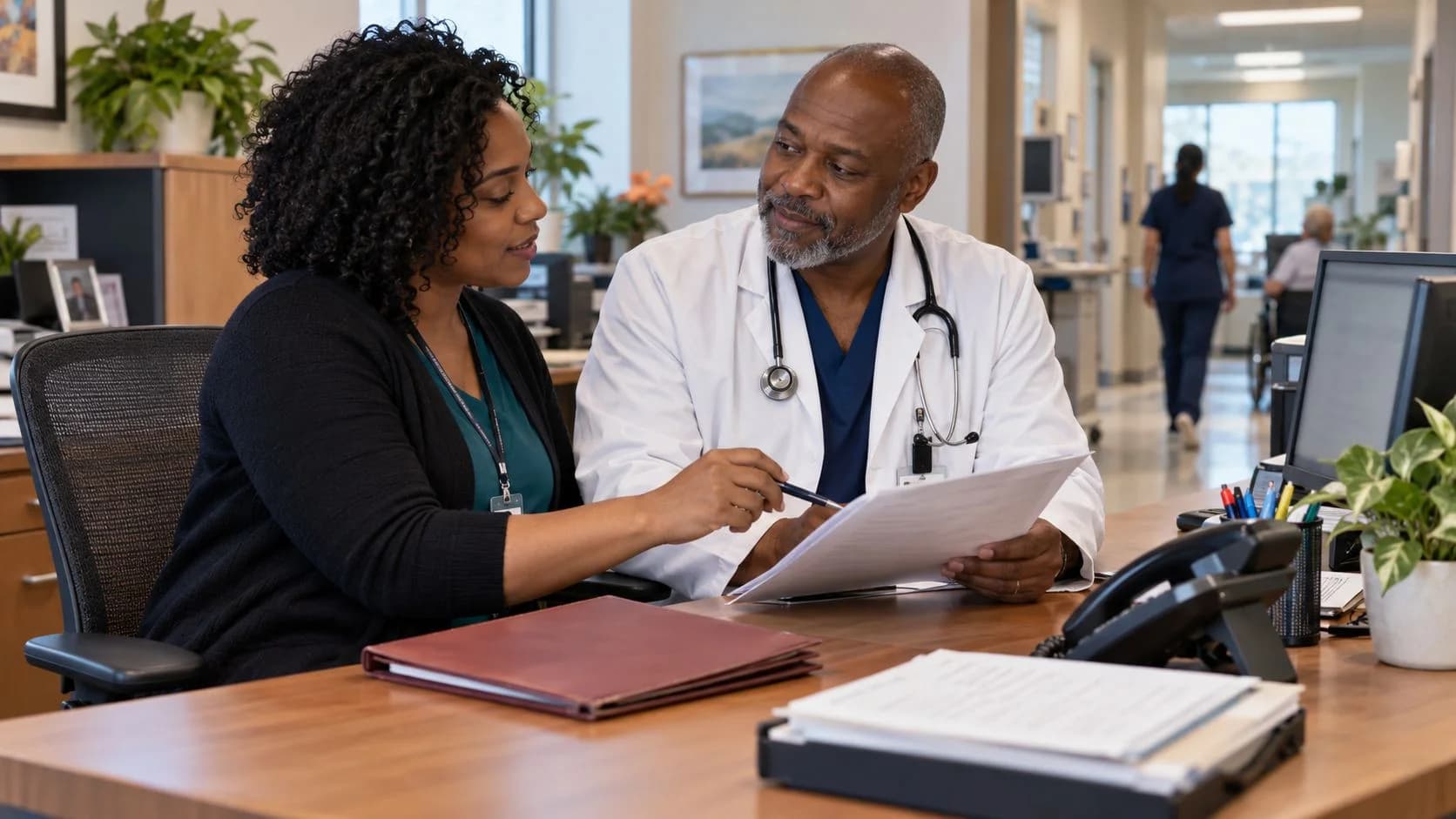 Medical coder and clinician resolving a claim detail together