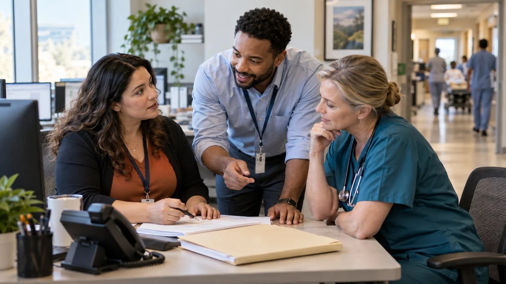 Denial-resolution specialist and clinician reviewing a claim together