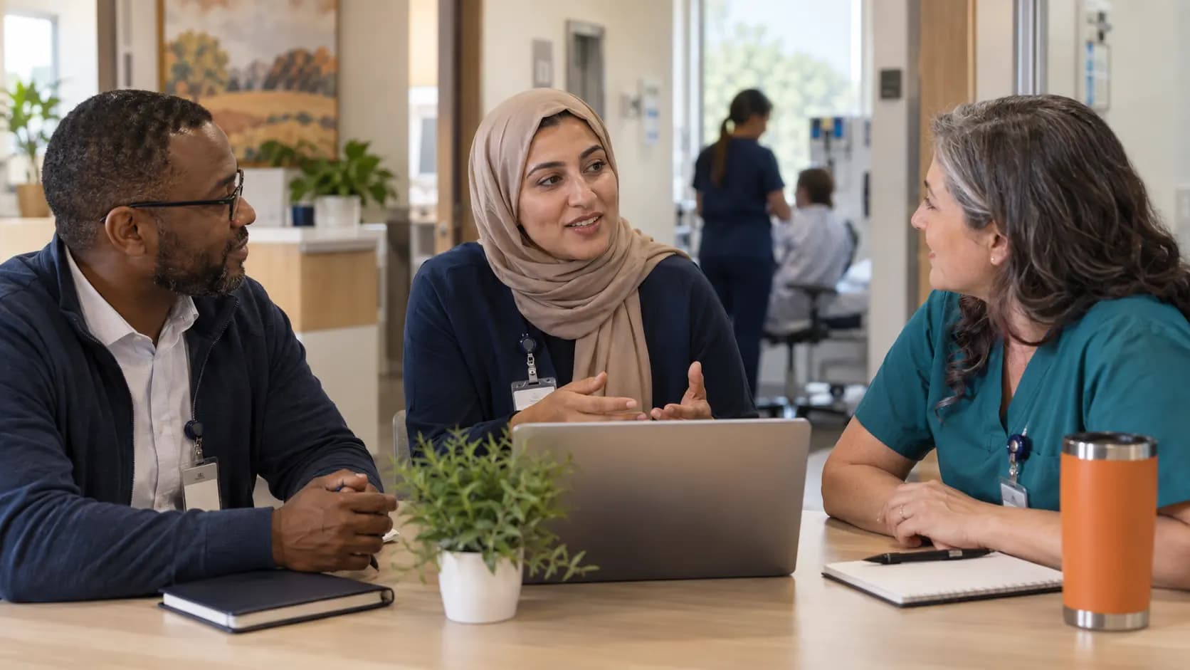 Healthcare operations and compliance colleagues collaborating in an office