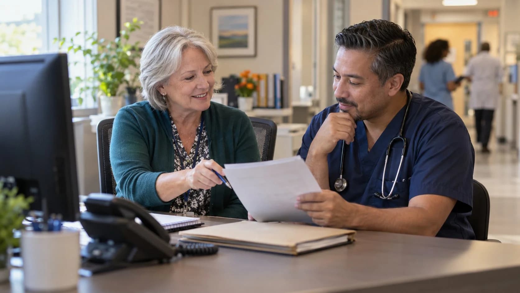 Medical coder and clinician resolving a claim detail together