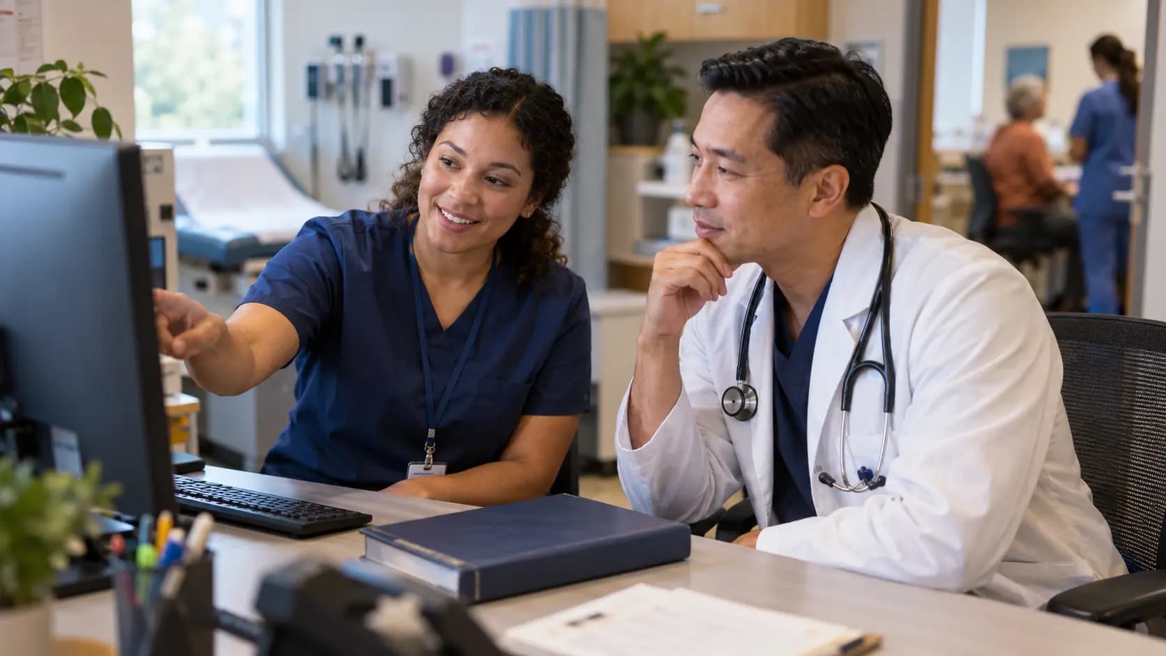 Medical coder and clinician resolving documentation together