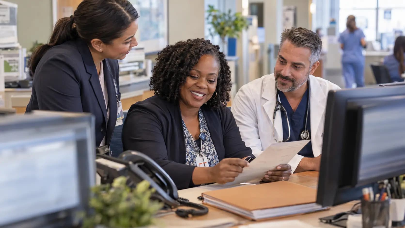 Revenue-cycle specialist and clinician resolving a billing workflow together