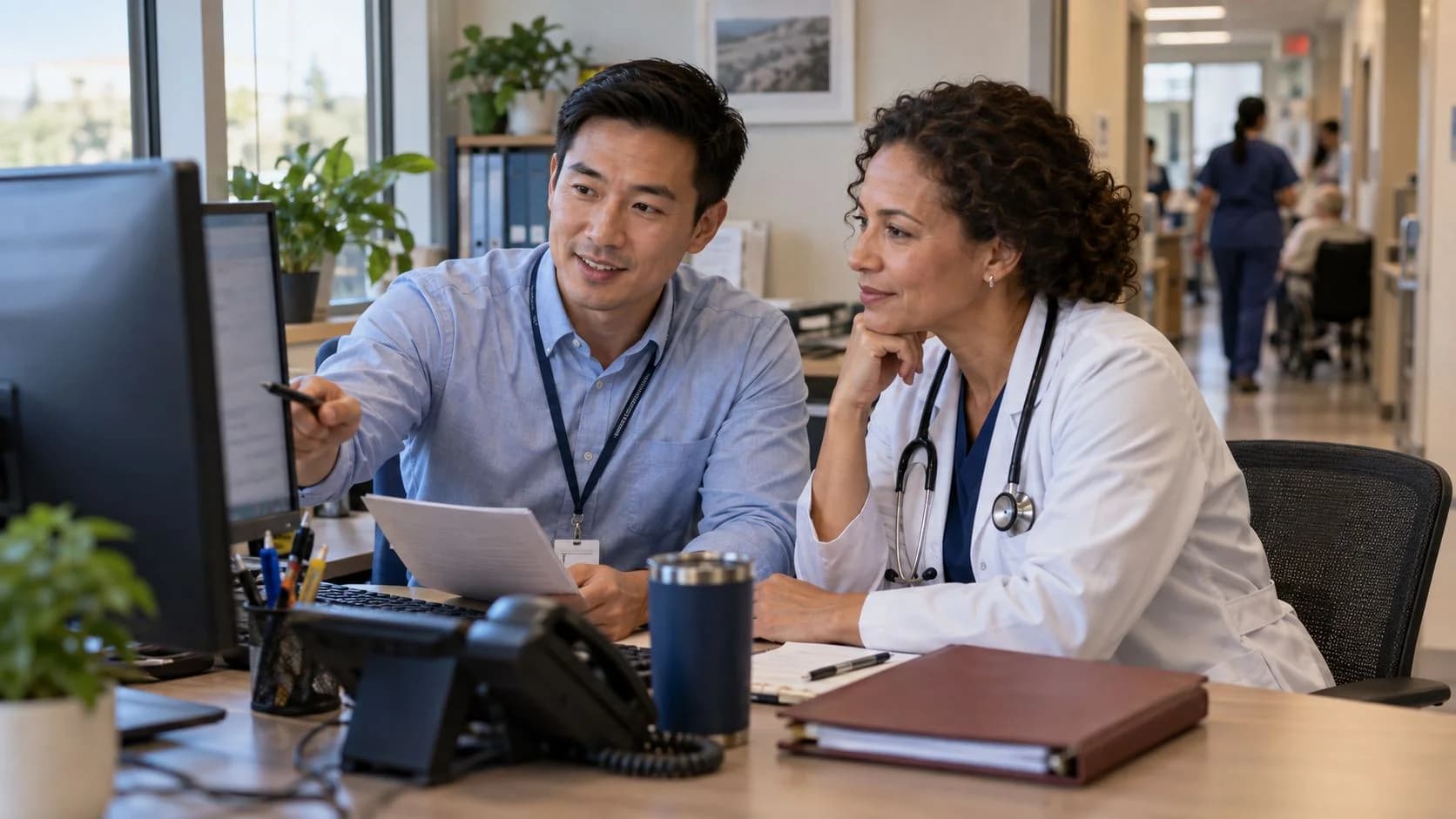 Medical coder and clinician resolving a claim detail together
