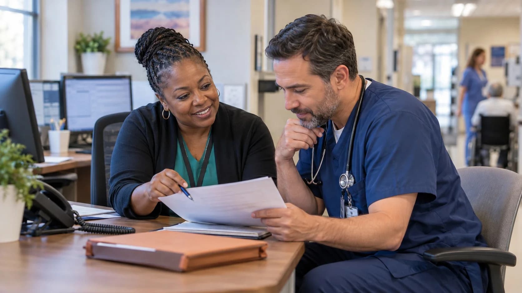 Medical coder and clinician resolving a claim detail together