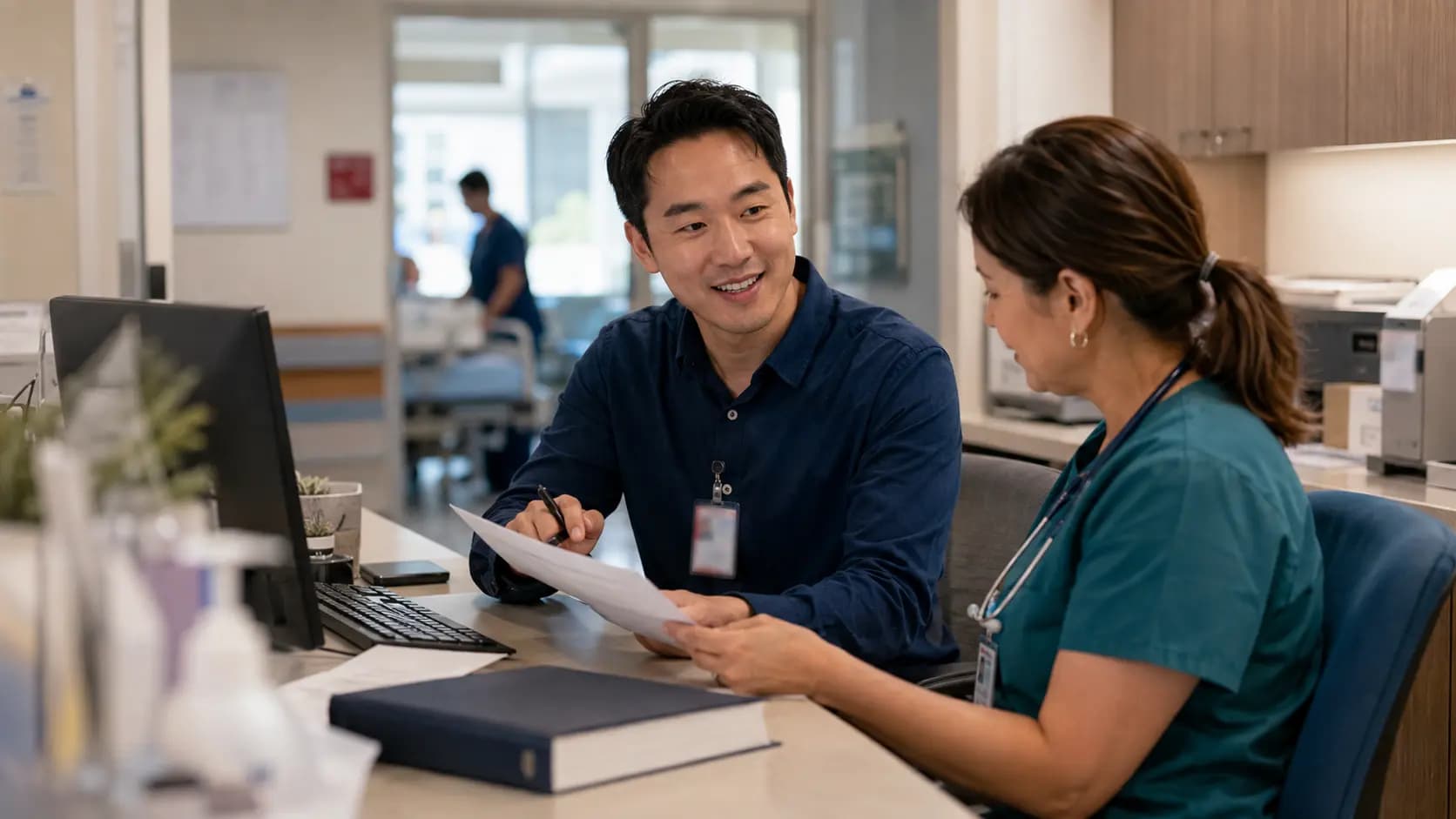 Medical coder and clinician resolving documentation together Medical coder and clinician resolving documentation together
